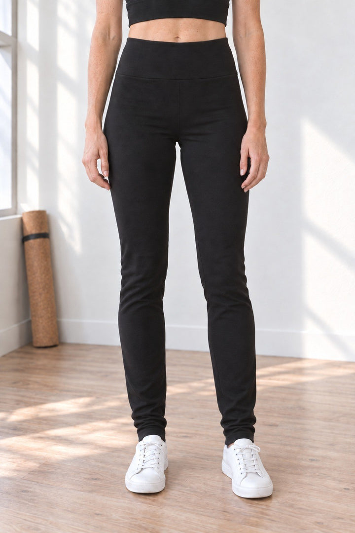 Front view of black organic cotton leggings with 33" tall inseam reaching the ankle, high-rise waistband