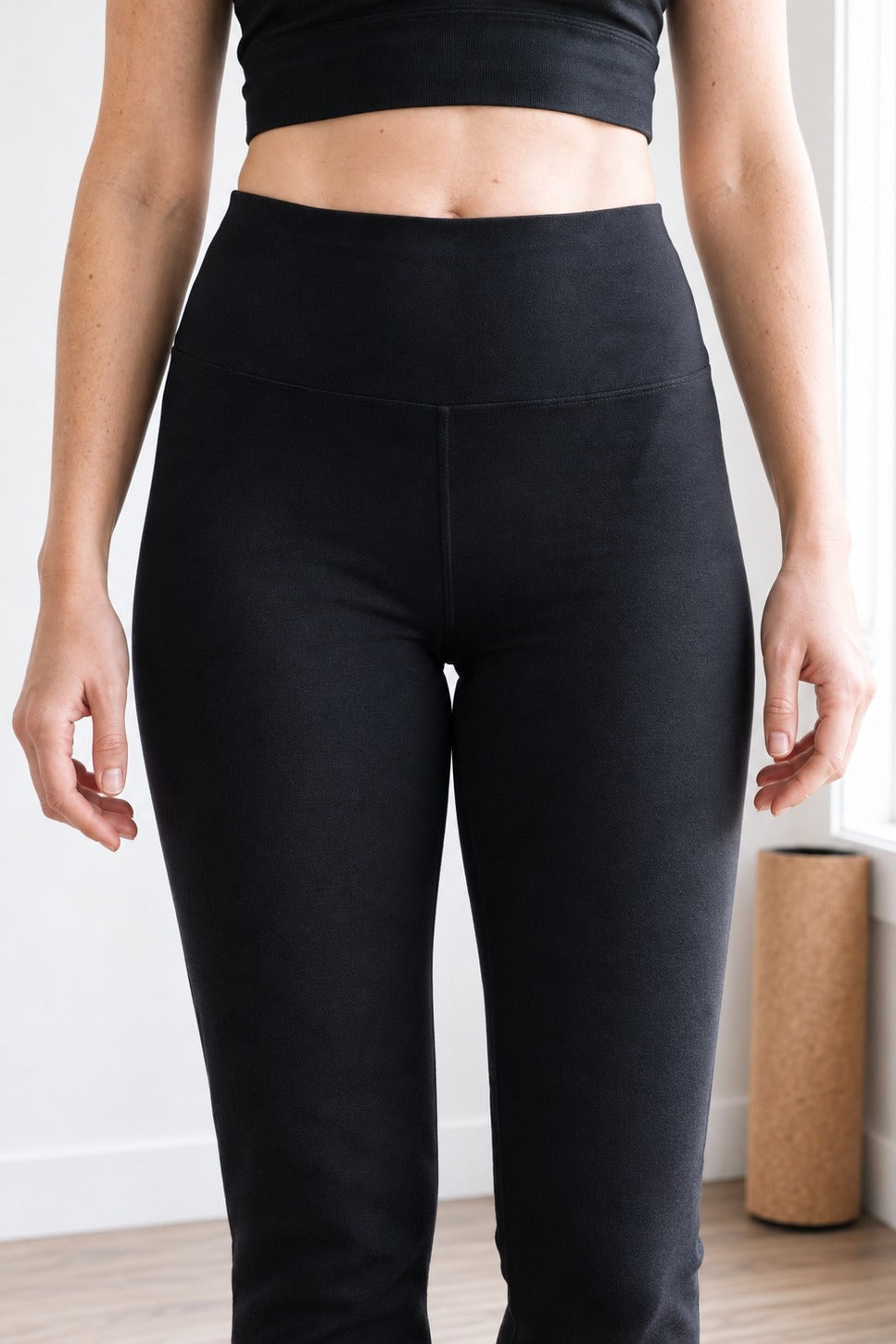 Close-up of the wide, soft rounded high-rise waistband on black organic cotton leggings 30"