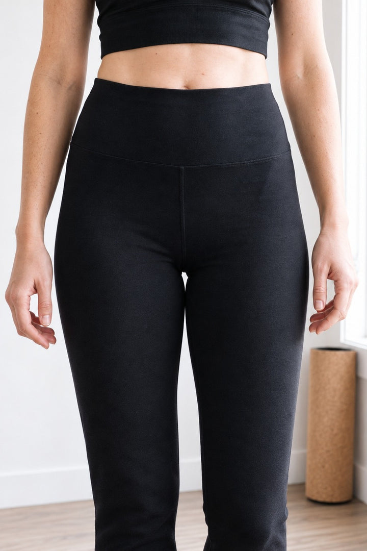 Close-up of the wide, soft rounded high-rise waistband on black organic cotton leggings 30"